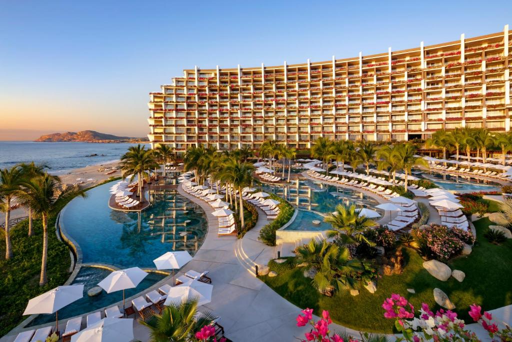 Pool and pool deck with rooms surrounding it at the Grand Velas Los Cabos, one of the best all-inclusives in Mexico