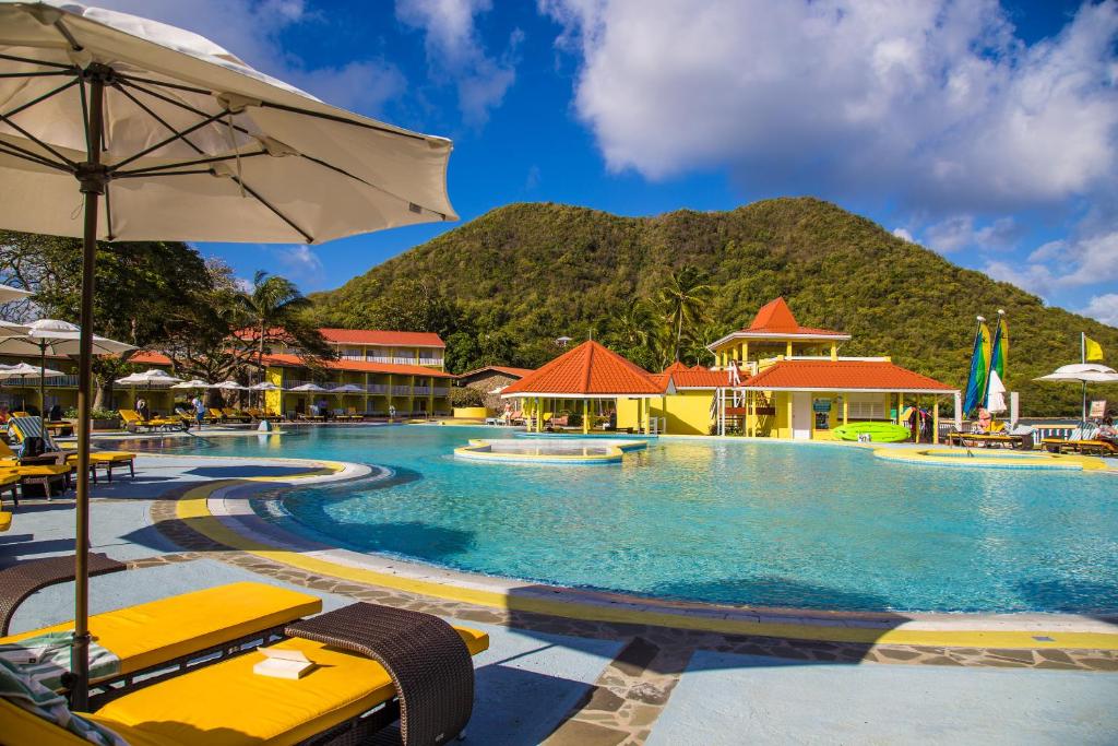 Pool with yellow lounge chairs at the Starfish St. Lucia, one of the best all-inclusive resorts on the island