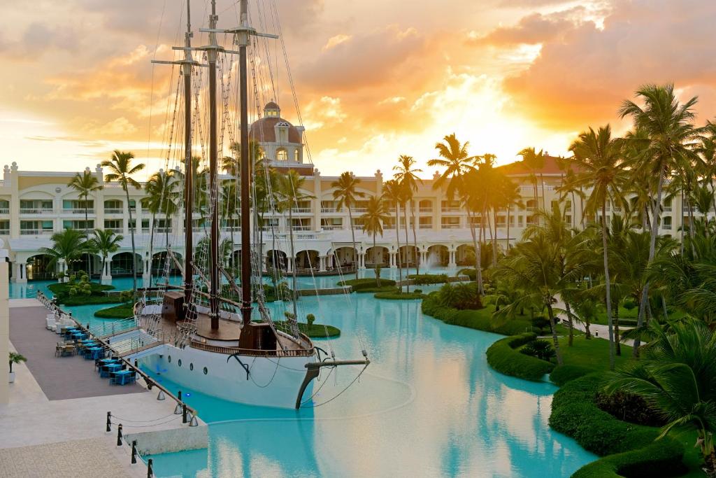 Sun setting over the boat at one of the best all-inclusive resorts in Punta Cana, the Iberostar Grand Bavaro