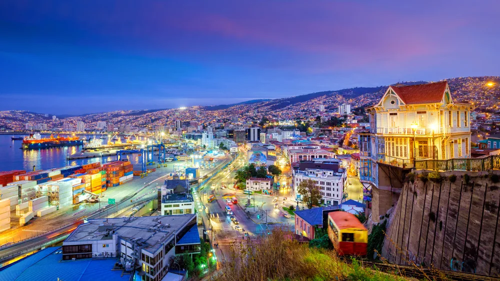 Evening view of the hillside of Valparaiso, one of the best places to visit in Chile, pictured on a nice night with lights from all the buildings