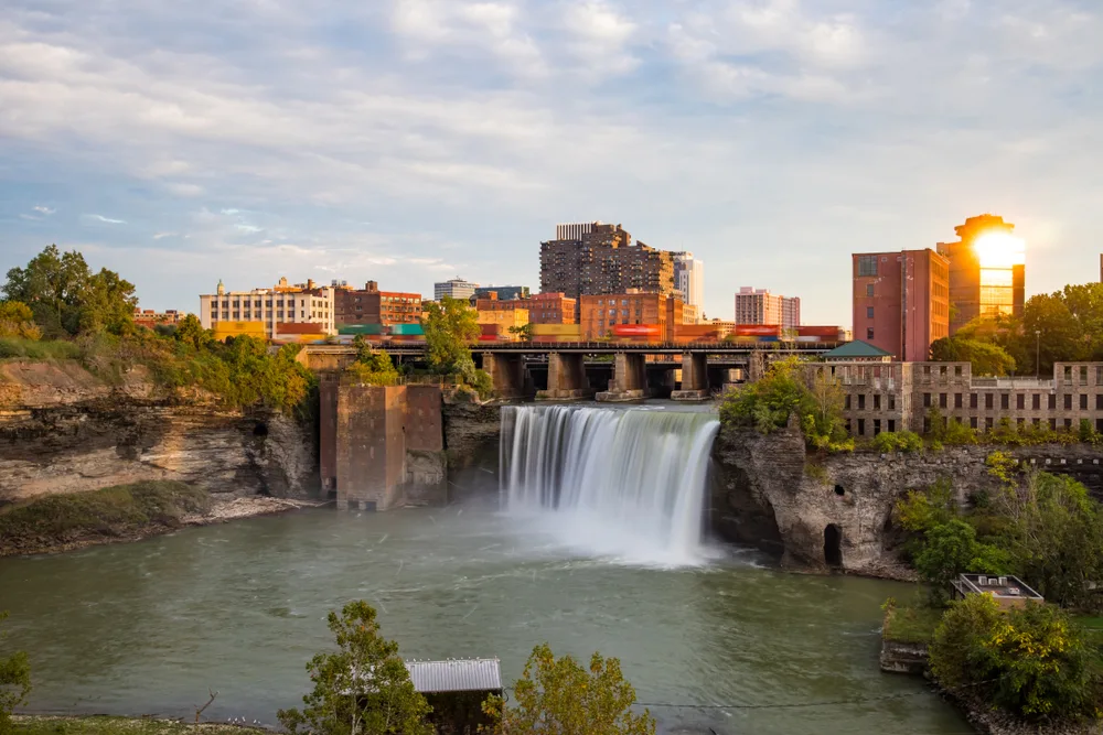 Pretty view of the High Falls pictured pouring over a steep rock face in Rochester, a must-visit place in Minnesota