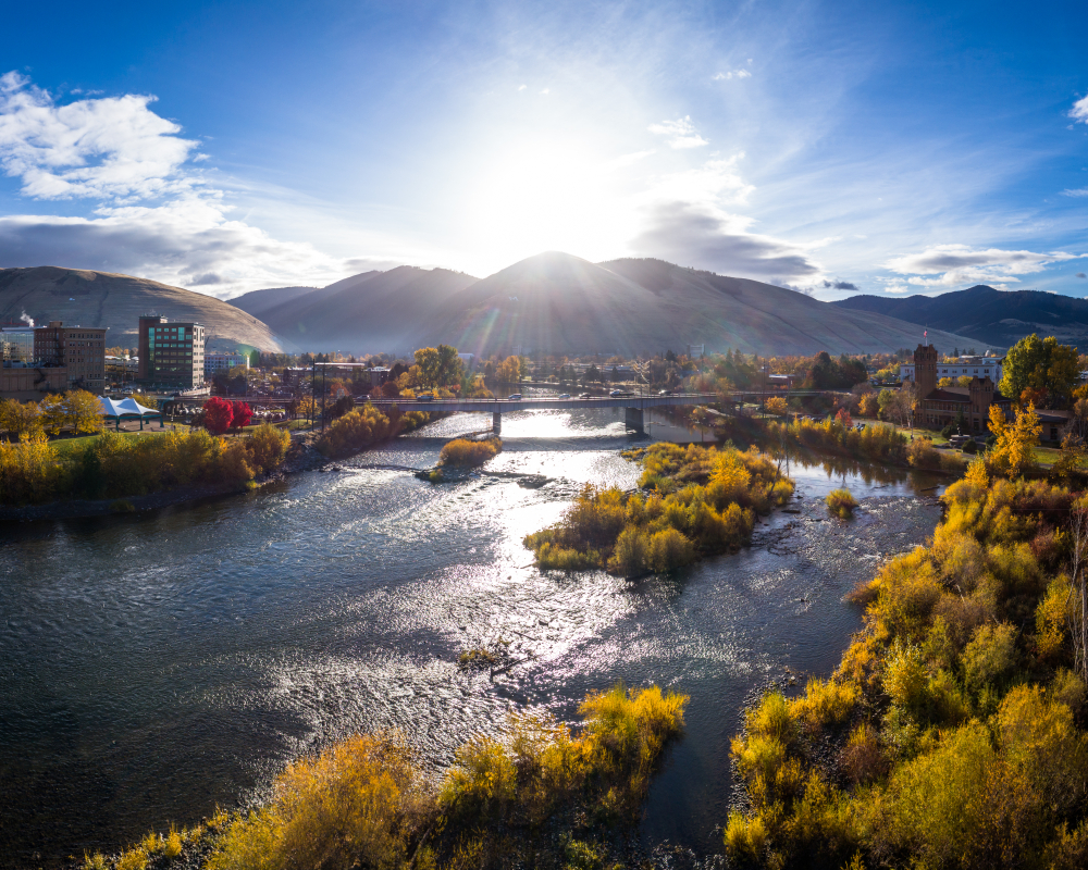 Gorgeous aerial view of the Higgins Street Bridge spanning the rive in Missoula, one of our top picks for where to stay in Montana