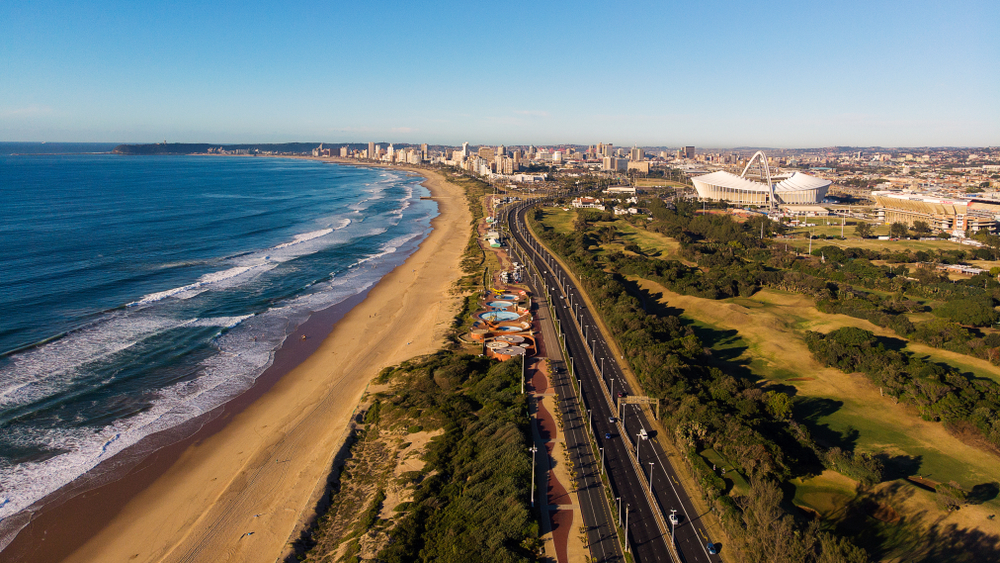 Idyllic aerial view of the coastline of Durban pictured on a still day with waves lightly lapping the water