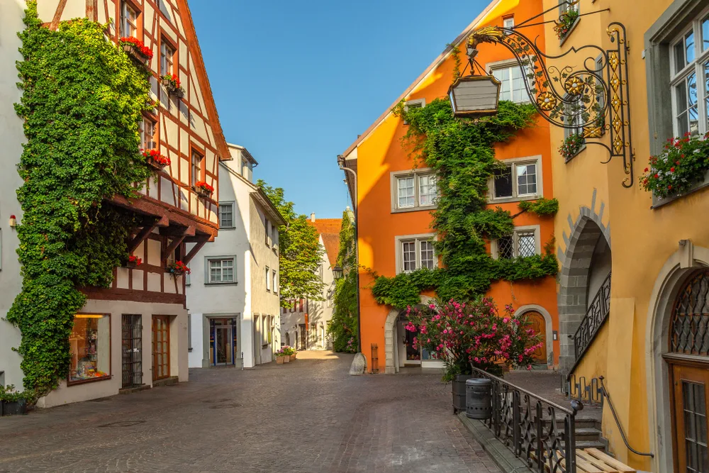 White, brown, and orange buildings line the stone streets of Meersburg, a top pick for places to visit in Germany