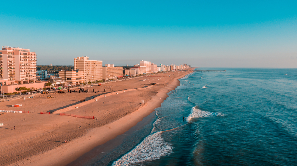 Aerial view of the endless beach in Virginia Beach pictured on a nice day with few people on the coast for a piece on the best time to visit Virginia state