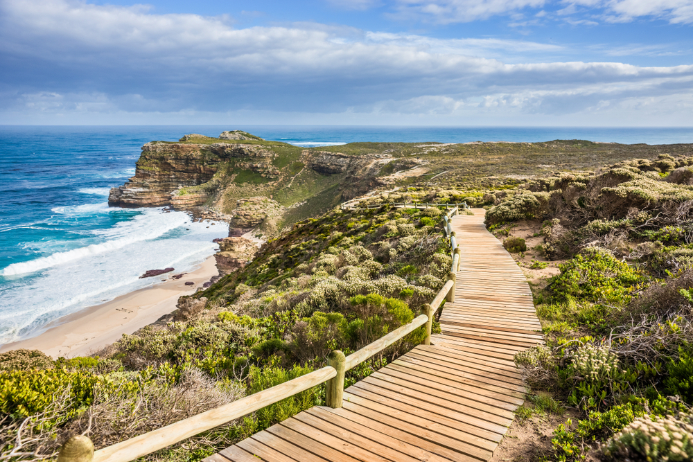 Walkway along the Cape Peninsula, one of the best places to visit in South Africa, with clouds overhead