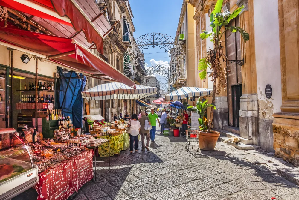 Neat street view of the idyllic town of Palermo, one of the best places to visit in Italy, as seen from the street market