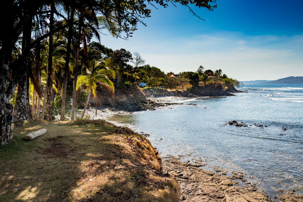 Neat view of the Santa Catalina Beach pictured from the coast with palm trees towering over the photographer in one of the best places to visit in Panama