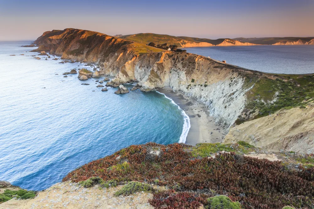 Idyllic view of the Point Reyes landscape and rocks running along the water for a piece on the best day trips from San Francisco