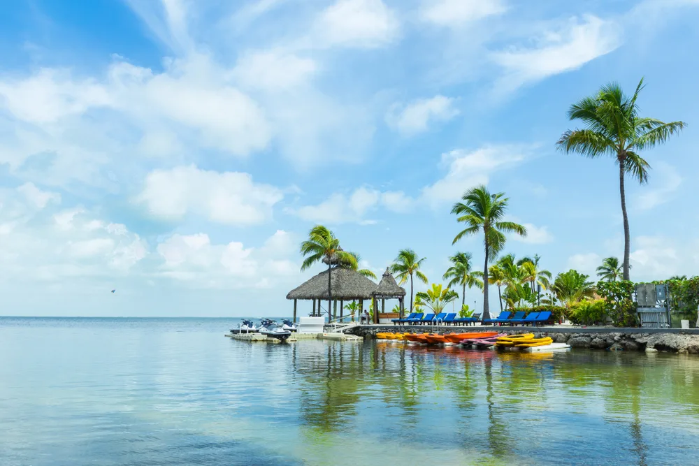 A view of palm trees and huts in Key Largo, one of the best islands in the Florida Keys to visit