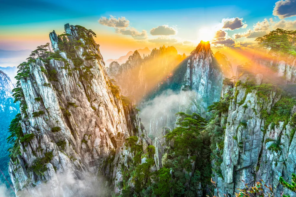Absolutely breathtaking view of the mountains of Huangshan, a top pick for places to visit in China, with its enormous and steep rock formations towering high into the sky
