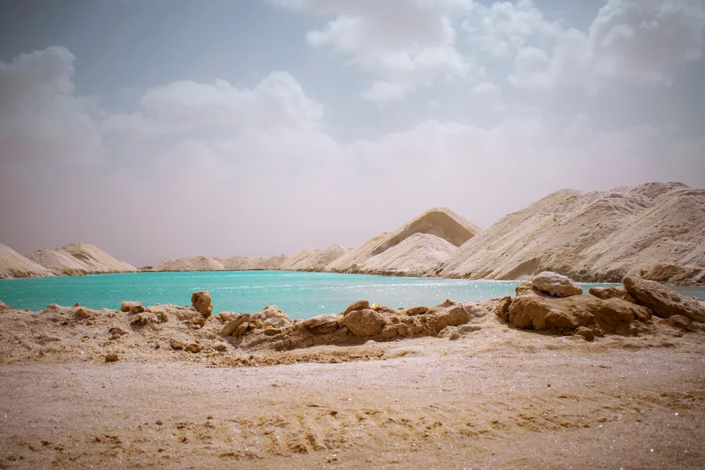 Giant piles of sand and salt surrounding the Siwa Oasis in Egypt, as seen with clouds rolling in from the distance