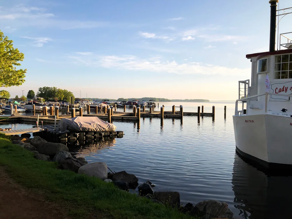 Boat docked in the pier of Lake Minnetonka near Minneapolis for a roundup of the best places to visit in Minnesota