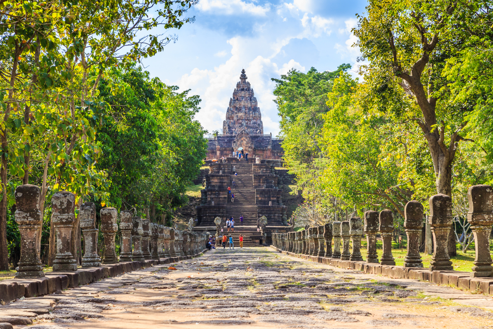 Phanom Rung temple and a long stone path leading to the temple pictured as a featured must-visit place in Thailand