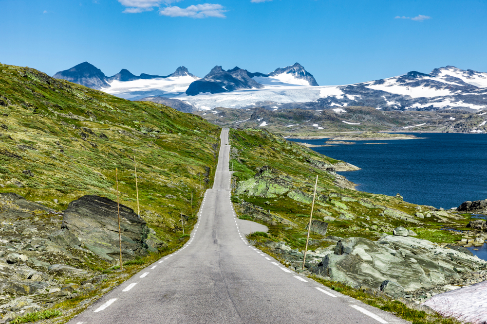 Long and straight road going through Jotunheimen National Park, one of the best places to visit in Norway