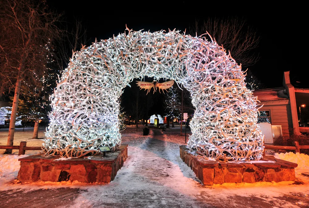 Christmas lights covering the giant elk antler's statue in Jackson Hole, as seen during Christmastime