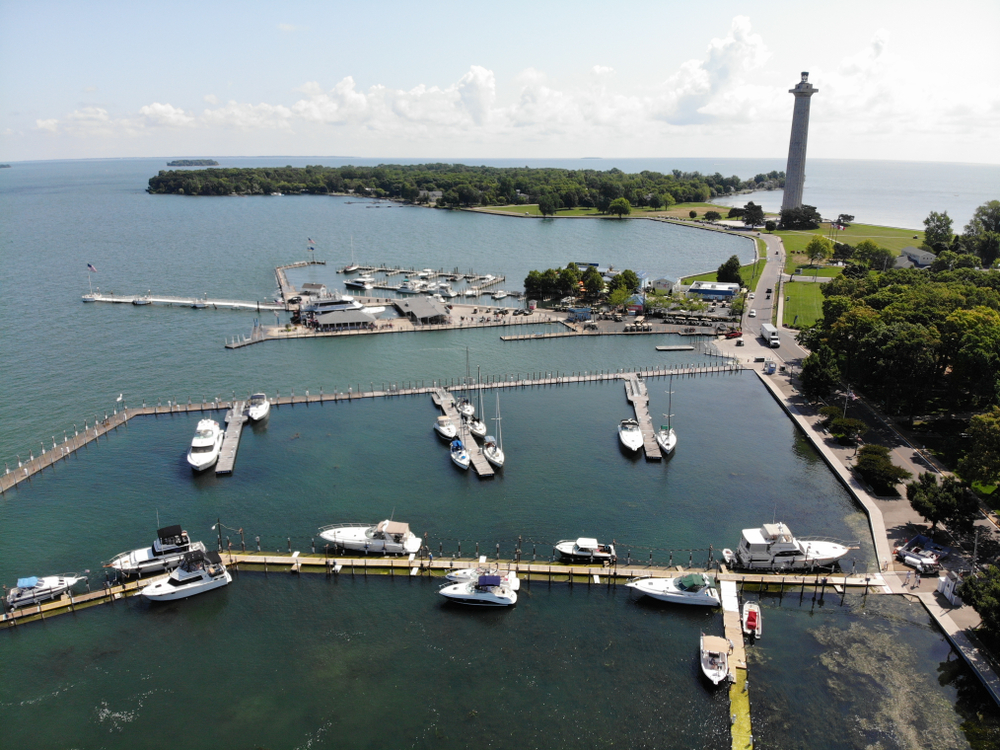 Aerial view of Put in Bay, one of Ohio's best places to visit, with its large marina and lighthouse overlooking the boats below
