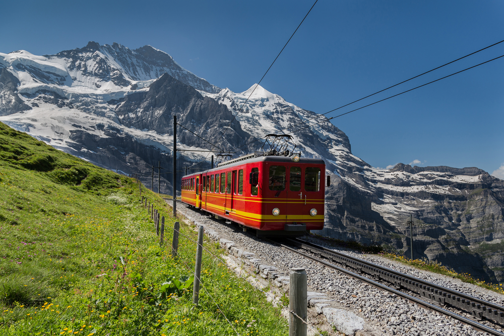 Red train the famous Jungfraujoch region, one of the best places to visit in Switzerland