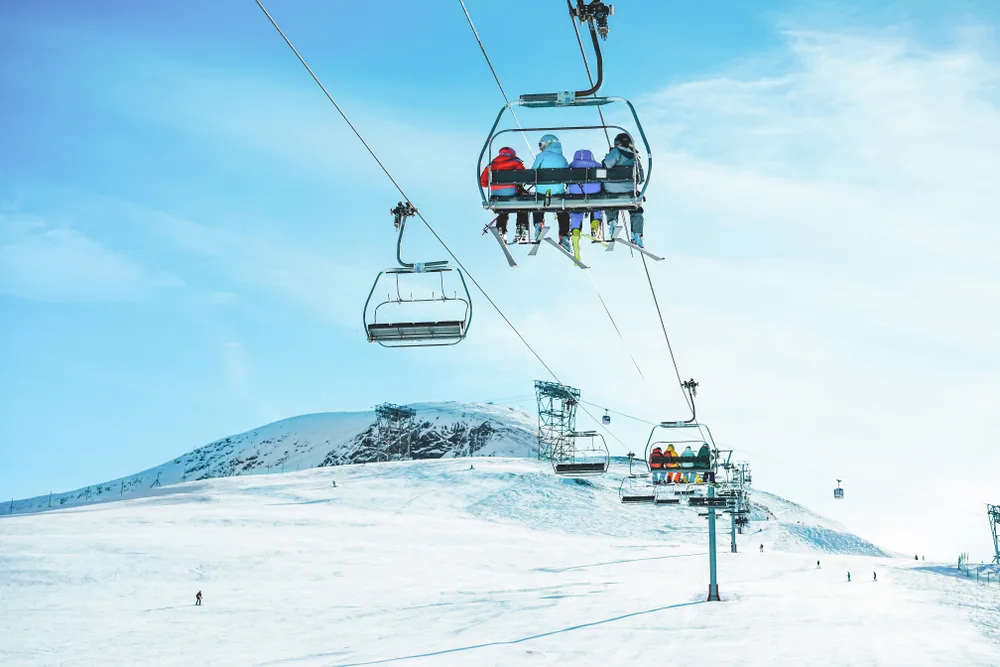 People on the lift of one of Colorado's best ski resorts on a sunny winter day