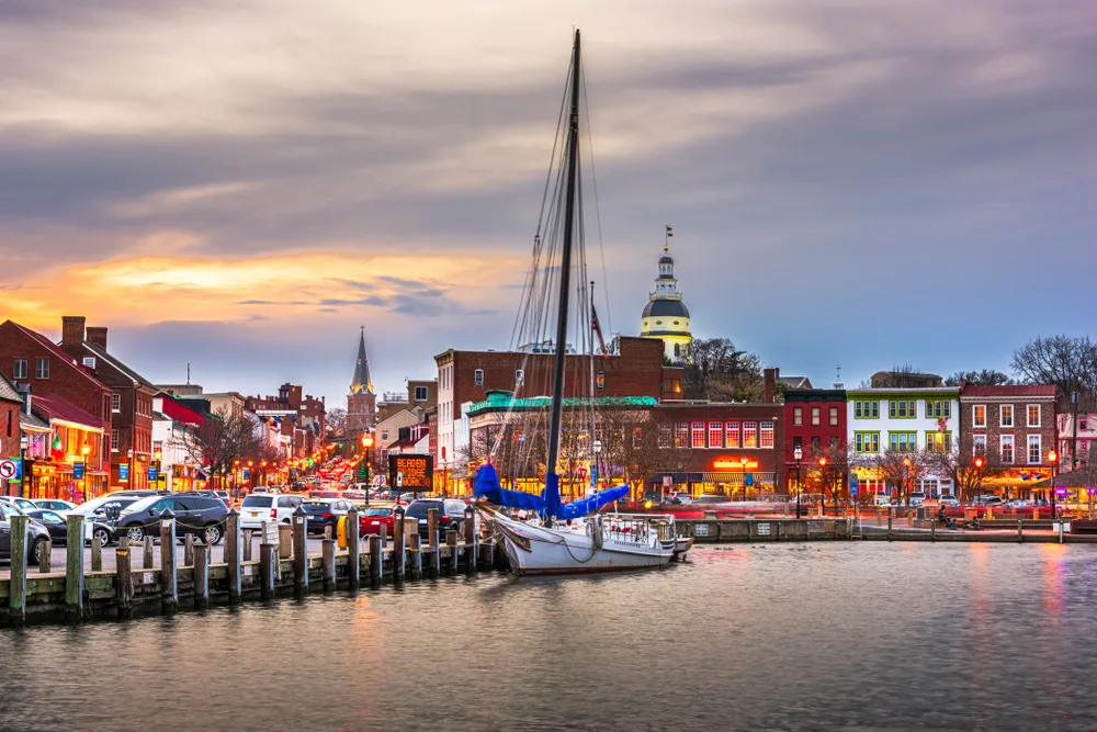 Annapolis Maryland pictured with a sailing boat on the ocean in the bay