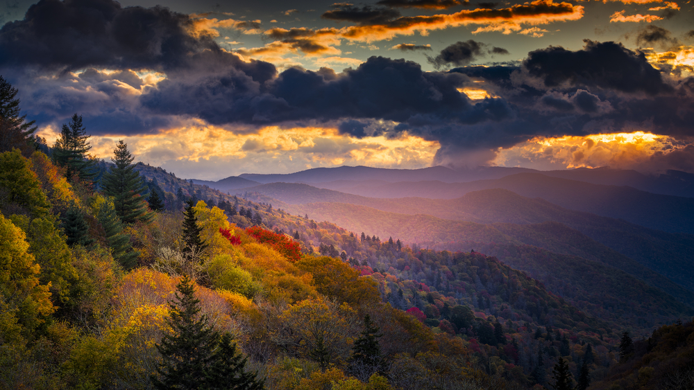 Shaft of golden sunlight illuminates the ridges of one of North Carolina's best places to visit, the Great Smoky Mountain National Park