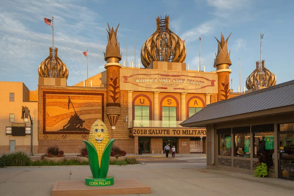 The Corn Palace in Mitchell, SD pictured as one of the must-visit places in the Midwest with gloomy skies overhead