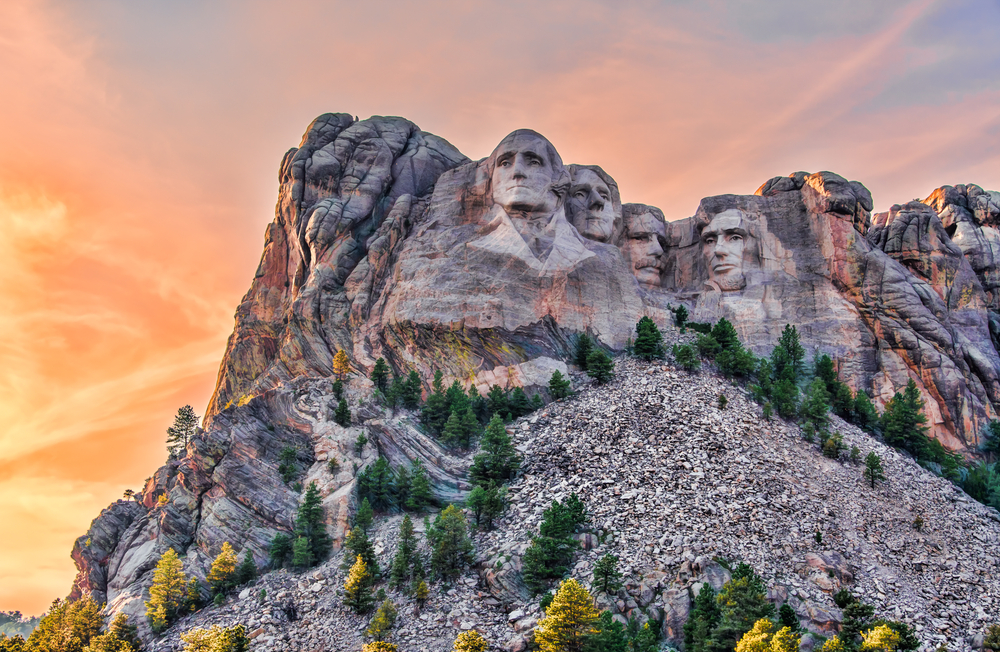 Mount Rushmore seen in the late evening light with four presidents overlooking the reader in the Black Hills, one of the best places to visit in the Midwest