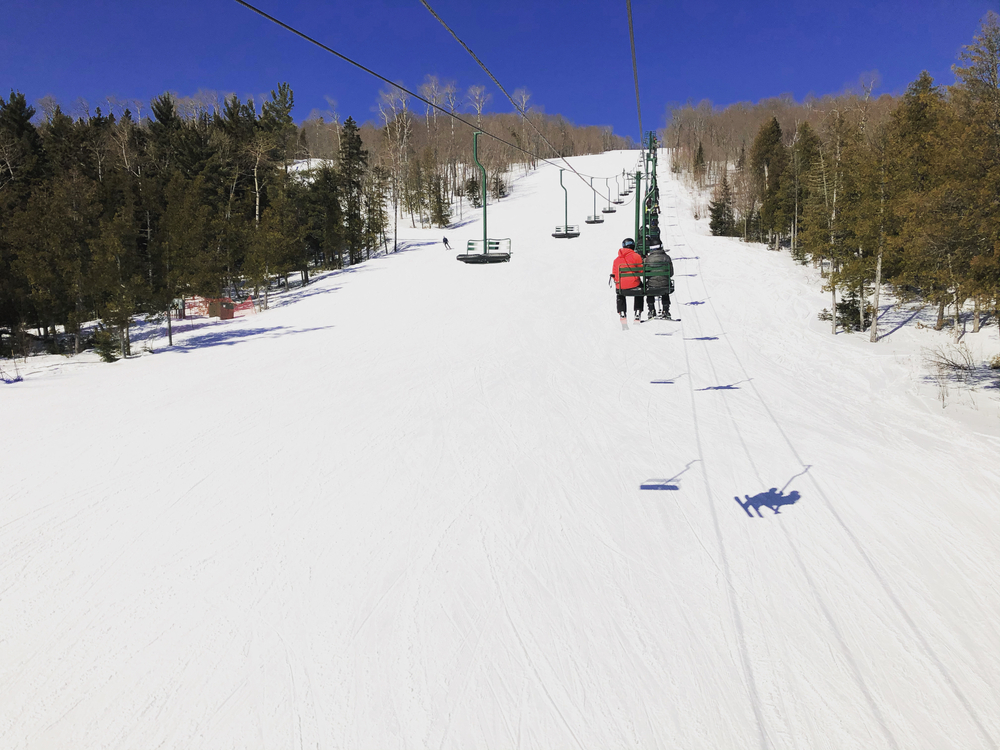 Sky lifts taking tourists up the ski hill in Lutsen, a top pick for the best place to visit in Minnesota