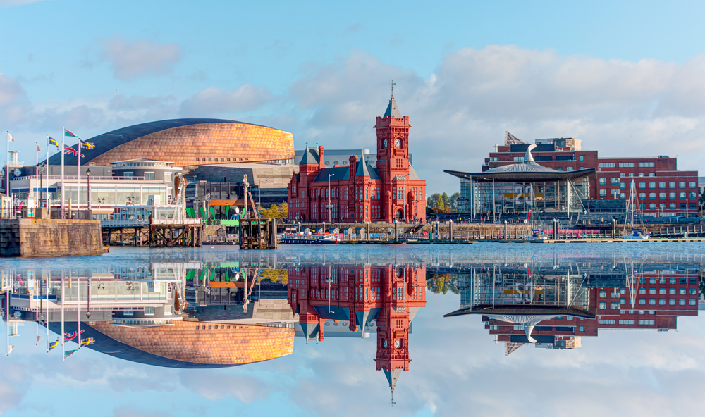 Panoramic view of Cardiff, a top pick for the must-take day trips from London, as seen with the downtown skyline reflecting in the water