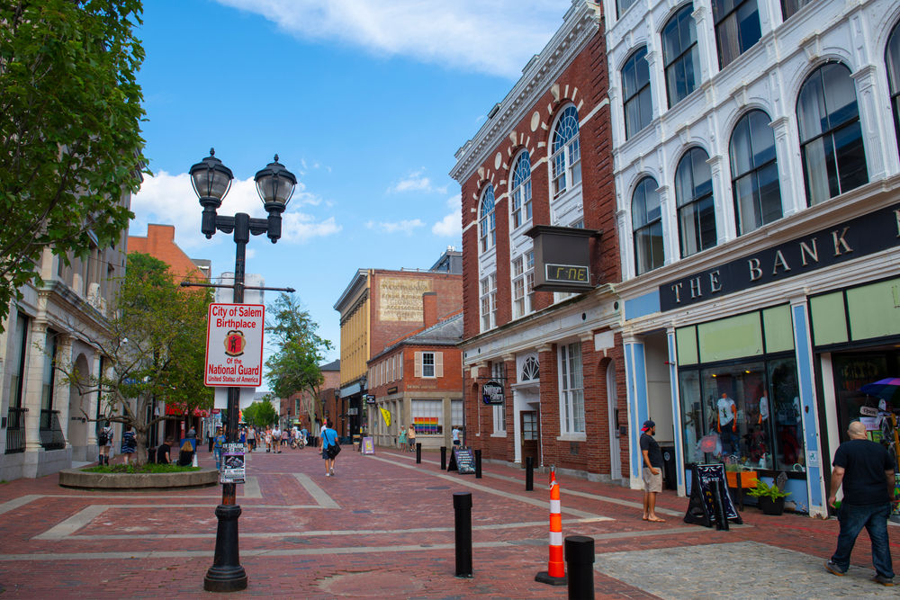 Downtown shops in Salem, MA, one of the best day trips from Boston, as seen on a nice day