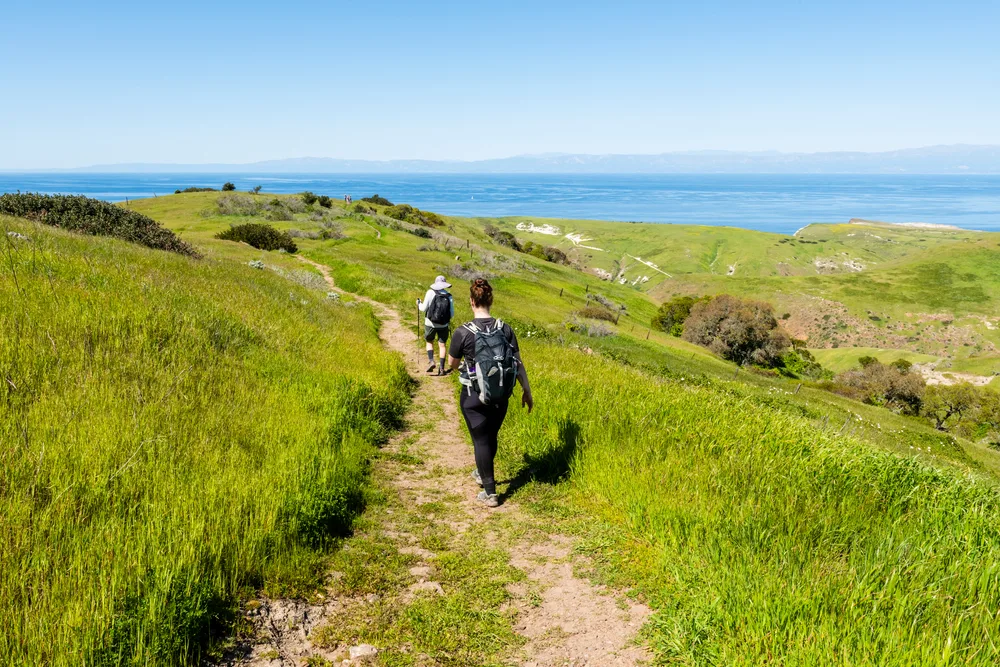 Hikers walk along the Scorpion Canyon Loop trail in the Channel Islands National Park, one of the best places to visit in Southern California