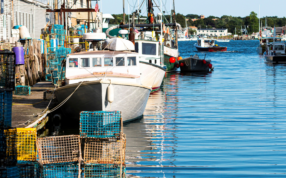 Lobster fishing boats docked in the marina in Portland, Maine, as seen head-on from the dock