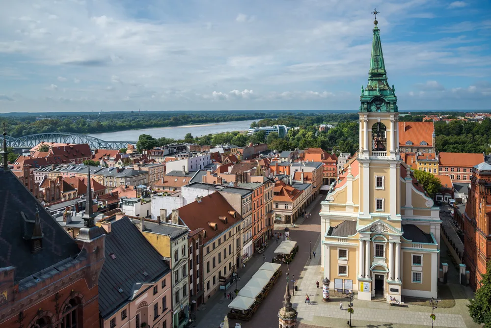 Aerial view of the neat town of Torun in Poland, one of the country's best places to visit, on a gloomy day with historical buildings and churches lining the narrow streets