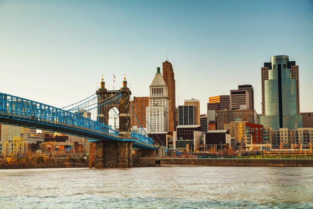 Downtown view of the bridge spanning the river in Cincinnati with its old buildings in full view of the camera
