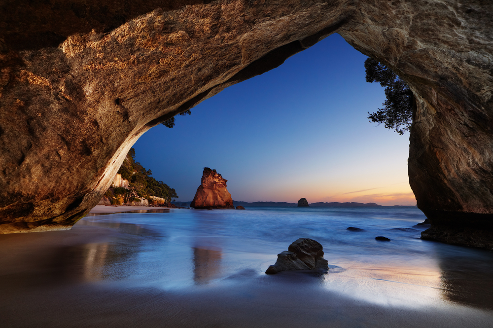 Cathedral Cove at the Bay of Islands in New Zealand, as seen from the inside of the cave looking outward