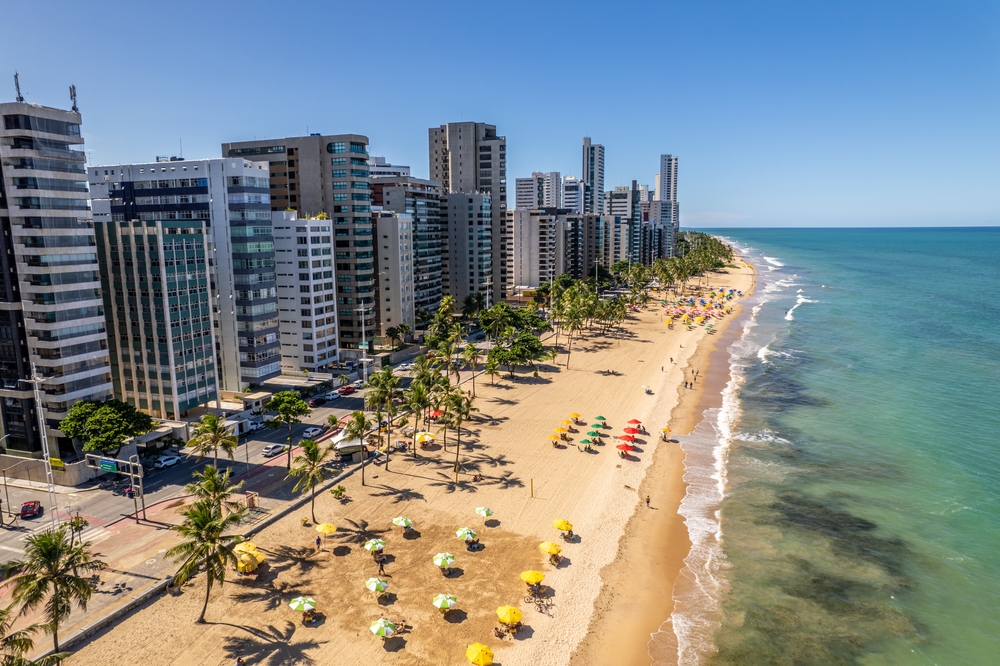 For a piece on the best places to visit in Brazil, aerial view of the coastline with high-rise hotels in Recife