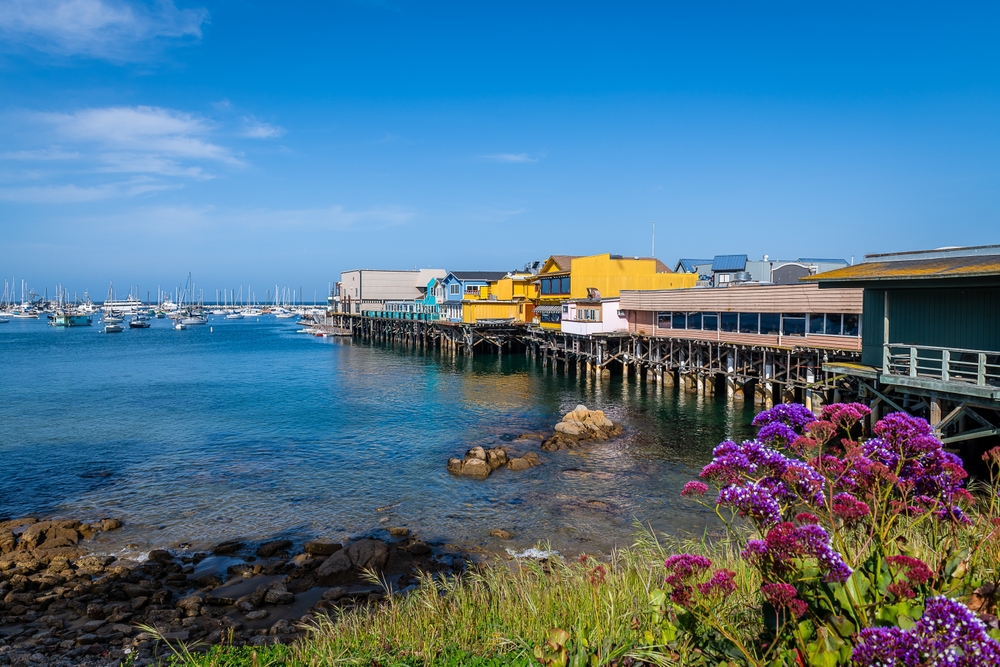 Buildings on stilts over the bay in Monterey, one of the best places to visit in California