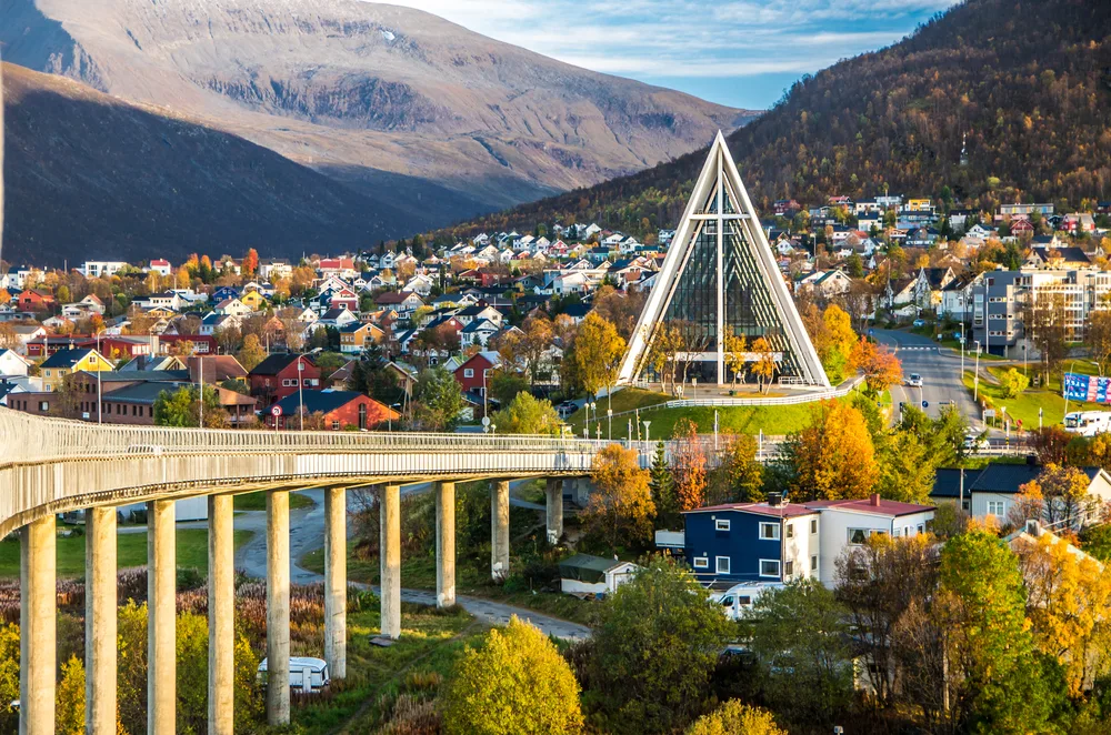 Modern glass cathedral pictured towering over the small town of Tromso in Norway, one of the country's best places to visit on a vacation