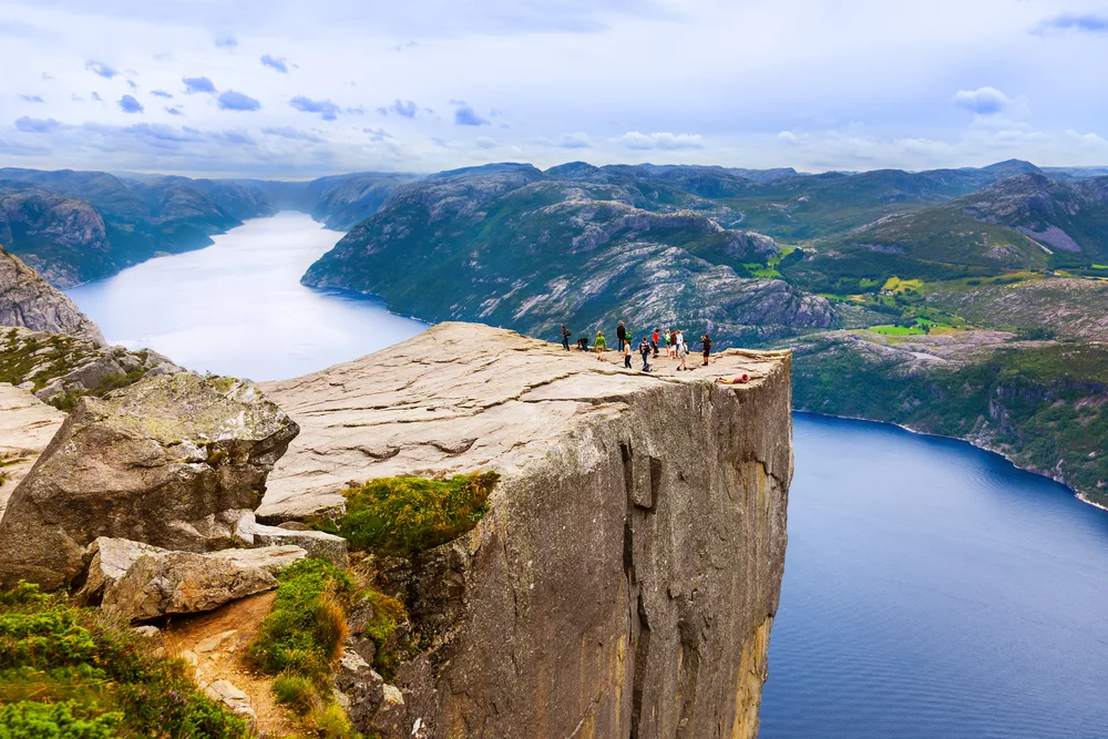 Aerial view of people standing on Pulpit Rock, one of the best places to visit on a trip to Norway