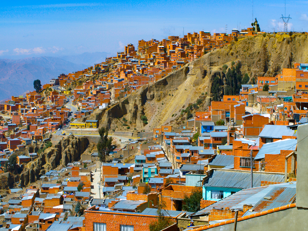 Steep cliffs with lots of shanty homes in La Paz, one of the worst places to visit in Bolivia due to its safety