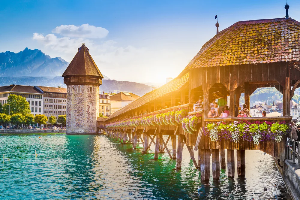 Idyllic view of the long wooden pier and dock at Lucerne, a top pick for the best places to visit in Switzerland