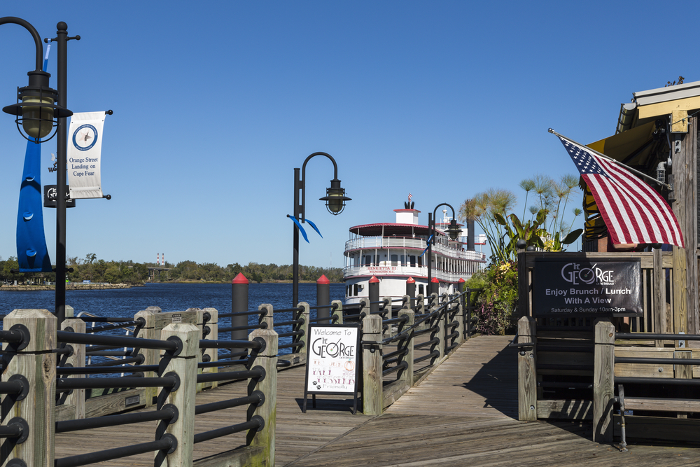 Ferry and the wooden boardwalk in the downtown area of Wilmington, one of the best places to visit in North Carolina