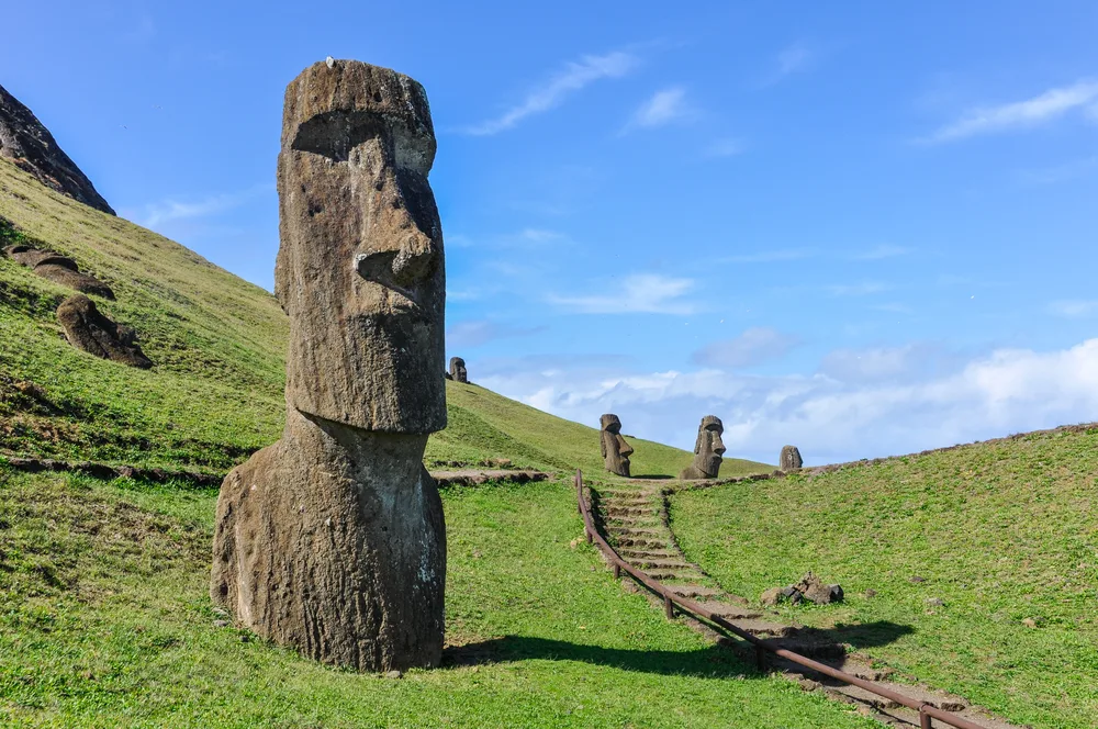 Giant stone head on Easter Island, one of the best places to visit in Chile, pictured on a blue-sky day