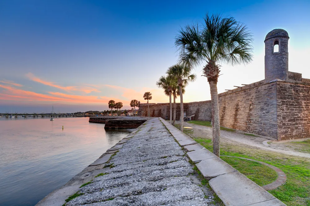 Ruins of Fort Augustine pictured alongside the ocean for a piece on the best time to visit St. Augustine