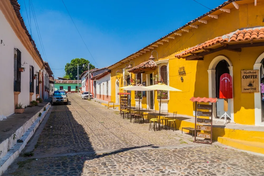 Neat image of yellow and white homes pictured in Suchitoto, one of the best places to visit in El Salvdaor