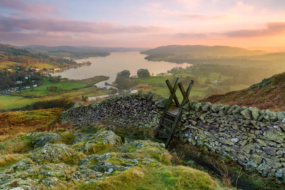 Sun setting over Windmere in the Lake District, one of England's best places to visit