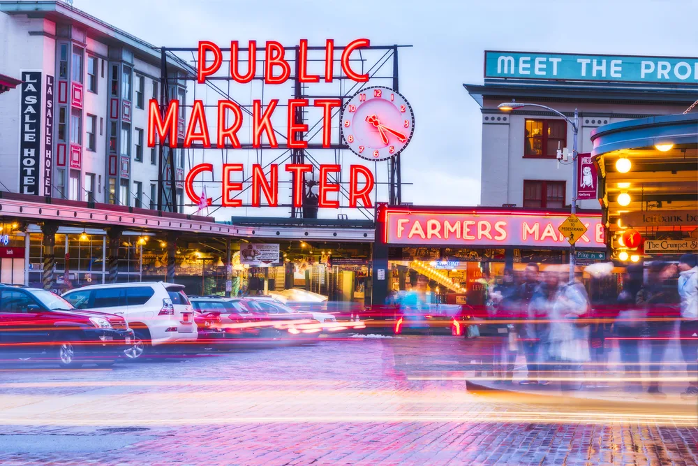 Pike Street Market and its famous red sign on a cloudy day in Seattle for a piece on whether or not the city is safe to visit