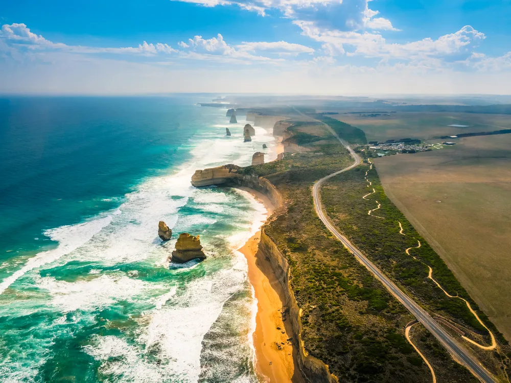 Stunning aerial view of the Twelve Apostles, one of our favorite places to visit in Australia, as seen along the Great Ocean Road