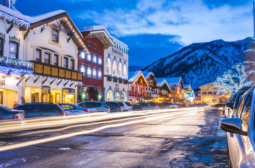 Night view of downtown Leavenworth Washington, seen on a snowy winter day, pictured as a featured day trip from Seattle
