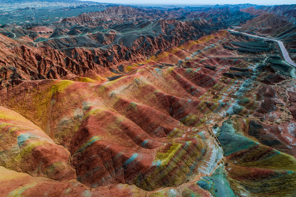 Aerial view of the rainbow-colored hills in the desert of Zhangye, a top pick for must-visit places in China